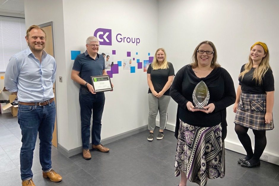 CK Group team members holding KellyOCG Supplier Excellence Award